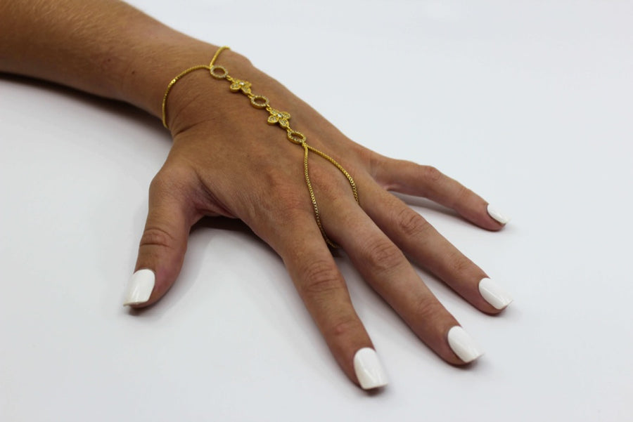 handmade hand jewelry; Attach around your middle finger and wrist for an exotic look; Gold plated chain and clover charms; Hand Jewelry; gold; diamonds; Budapest; exotic jewelry; gold hand jewelry; bracelet and ring combination in one jewelry piece
