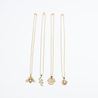 Gold plated mini ball chain with gold charms. Gold Necklaces. Bee Charm Necklace. Snake Charm Necklace. Coin Charm Necklace. Moon Star Charm Necklace. Gold Charm Necklaces. Diamond Charm Necklaces. Charm with cz detail. Handmade Jewelry. Miami Jewelry. Affordable Sustainable Jewelry. Affordable Prices. Jewellery. Jewelry stores. Charms. Handcrafted. Miami Jewelers. Miami-Based Jewelry. Customized Jewelry. Jewelry stores near me. Necklace. Necklaces. Charms. MCHARMS. 