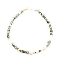 Beachy Necklace I MCHARMS Beautiful mix of grey green pukka, mother of pearl beads and a touch of gold with pearls. 15-17 inches in length. Grey Pukka. Green Pukka. Green Necklace. Pearl Necklace. Beaded Necklace. Necklaces. Handmade Jewelry. Miami Jewelry. Affordable Sustainable Jewelry. Affordable Prices. Jewellery. Jewelry stores. Shop Jewelry. MCHARMS. Charms. Handcrafted Jewelry. Miami Jewelers. Miami based Jewelry. Miami-Based Jewelry. Customized Jewelry. Mcharms.