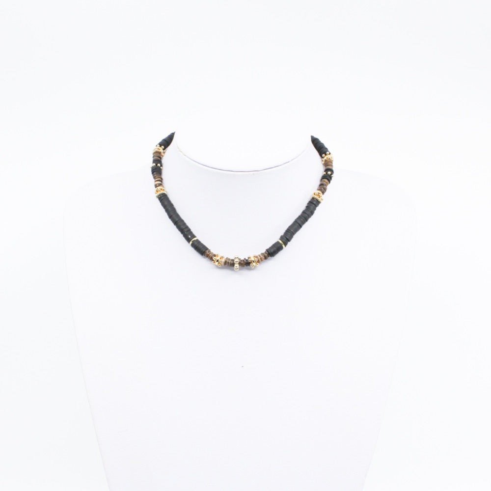 Tiger Puka. Stunning black puka mixed with gold plated spacers, and brown beads. Handmade Jewelry. Stunning black and gold necklace. 16-18 inches in length. Shop Jewelry. MCHARMS. Women Necklace. Girl Necklace. Ocean Vibes. Gold Jewelry. Black Jewelry. Brown Jewelry. Miami. Miami Jewelry. Affordable Sustainable Jewelry. Affordable Prices. Jewellery. Jewelry stores. Handcrafted Jewelry. 