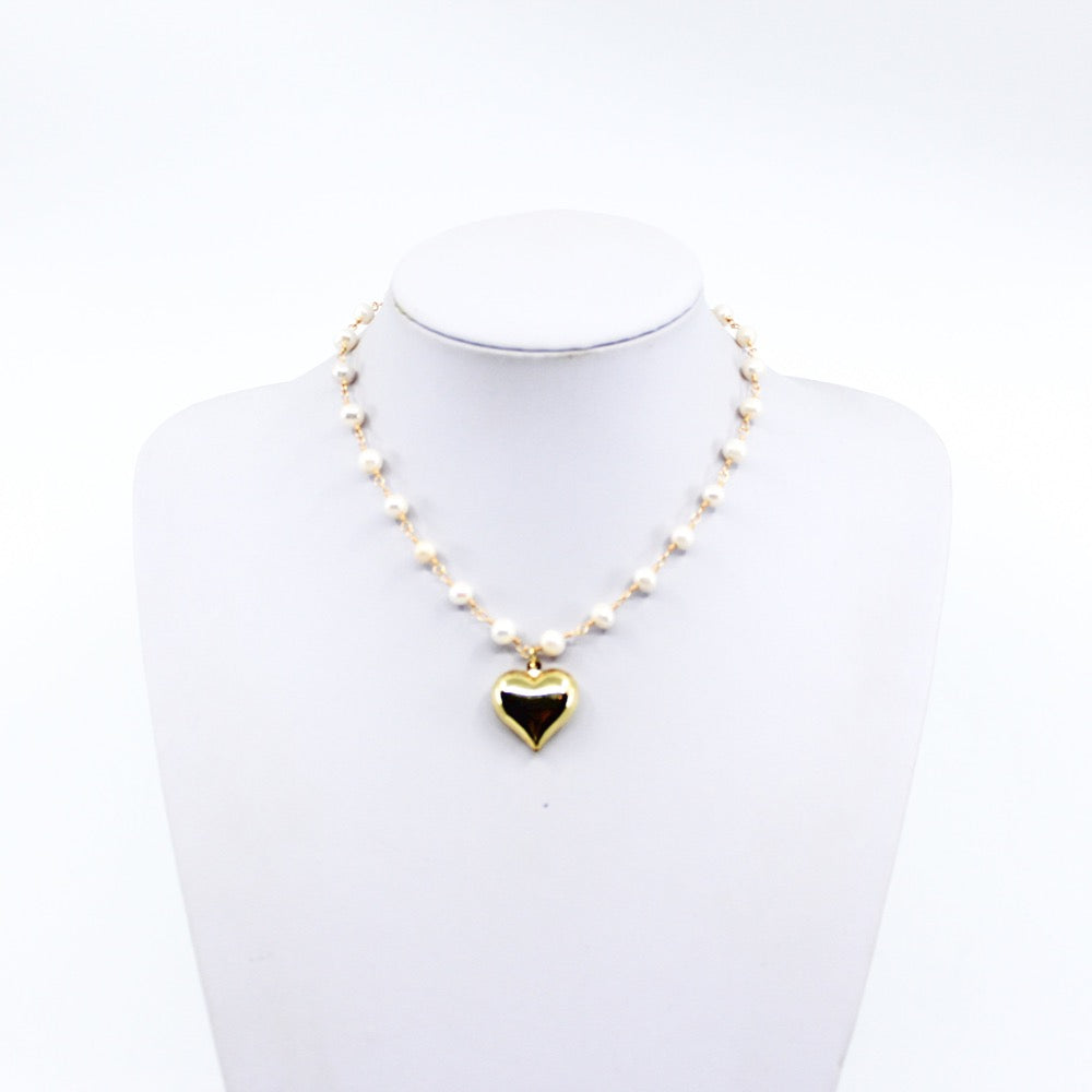 Pearl Puffy Heart Necklace. String of pearls necklace with gold puffy heart chart. Chose your style: plain, or 1 charm / letter. 14-16 inches in length. Valentines Collection. Pearl Necklace. Pearl Heart Necklace. Pearl Necklace with Heart Charm/s. Charms. Charm Necklace. Pearl Heart Initial/s Necklace. Gold Necklace. Handmade Jewelry. Miami Jewelry. Affordable Sustainable Jewelry. Affordable Prices. Jewellery. Jewelry stores. Shop Jewelry. MCHARMS. Charms. Charm Necklace. Necklace. Necklaces.