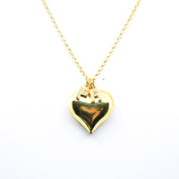 Puffy Heart Necklace. Brazilian gold plated rolo chain with gold puffy heart charm. Chose your style: plain, or 1 initial letter. 14-16 inches in length. Valentines Collection. Gold Necklace. Gold Heart Necklace. Gold Necklace with Heart Charm/s. Charms. Charm Necklace. Gold Heart Initial/s Necklace. Handmade Jewelry. Miami Jewelry. Affordable Sustainable Jewelry. Affordable Prices. Jewellery. Jewelry stores. Shop Jewelry. MCHARMS. Charms. Charm Necklace. Necklace. Necklaces.