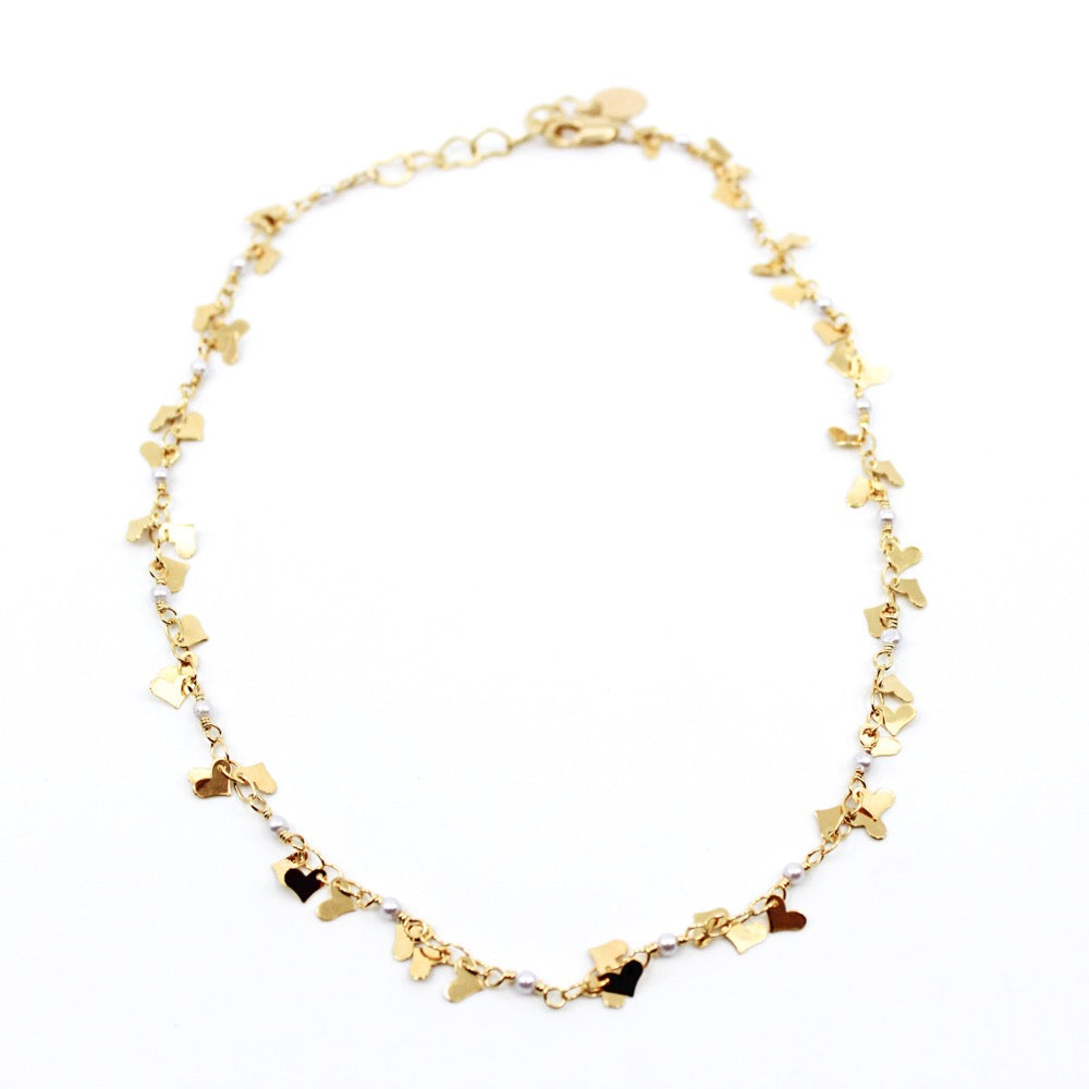 Heart Dangle Necklace. Brazilian gold plated heart chain with mini heart charms. 15-17 inches in length. Valentines Collection. Mini Gold Heart Necklace. Gold Heart Chain Necklace. Gold Necklace. Gold Choker. Heart Necklace. Heart Choker. Heart Chain Necklace with Charm/s. Heart Charm/s. Heart Charm Necklace. Handmade Jewelry. Miami Jewelry. Affordable Sustainable Jewelry. Affordable Prices. Jewellery. Jewelry stores. Shop Jewelry. MCHARMS. Charms. Charm Necklace. Necklace.