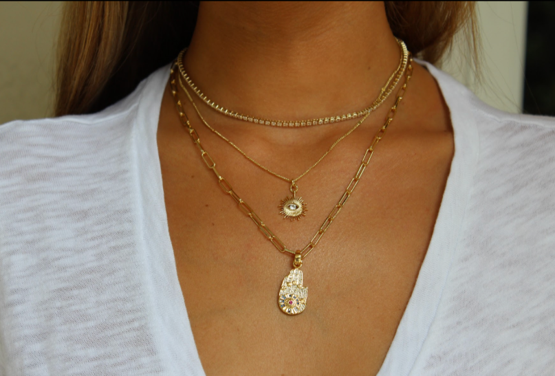 Marilyn Stack I MCHARMS Marilyn Stack. Stack includes combination of: Marilyn Necklace (13-16 inches in length), Eye in the Sky Necklace (16-18 inches in length), and Hamsa Charml Necklace (18 inches in length). Stack More and Save: when you buy the stack you receive 10% off the total individual necklace price! Gold Diamond Choker. Gold Necklace. Handmade Jewelry. Miami Jewelry. Affordable Sustainable Jewelry. Affordable Prices. Jewellery. Jewelry stores. Shop Jewelry. MCHARMS.
