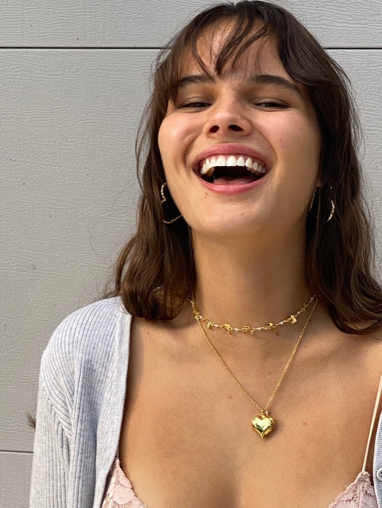  Heart Dangle Necklace. Brazilian gold plated heart chain with mini heart charms. 15-17 inches in length. Valentines Collection. Mini Gold Heart Necklace. Gold Heart Chain Necklace. Gold Necklace. Gold Choker. Heart Necklace. Heart Choker. Heart Chain Necklace with Charm/s. Heart Charm/s. Heart Charm Necklace. Handmade Jewelry. Miami Jewelry. Affordable Sustainable Jewelry. Affordable Prices. Jewellery. Jewelry stores. Shop Jewelry. MCHARMS. Charms. Charm Necklace. Necklace.