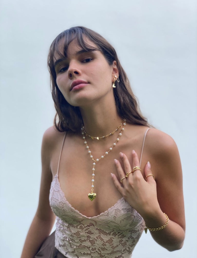  Heart Dangle Necklace. Brazilian gold plated heart chain with mini heart charms. 15-17 inches in length. Valentines Collection. Mini Gold Heart Necklace. Gold Heart Chain Necklace. Gold Necklace. Gold Choker. Heart Necklace. Heart Choker. Heart Chain Necklace with Charm/s. Heart Charm/s. Heart Charm Necklace. Handmade Jewelry. Miami Jewelry. Affordable Sustainable Jewelry. Affordable Prices. Jewellery. Jewelry stores. Shop Jewelry. MCHARMS. Charms. Charm Necklace. Necklace.